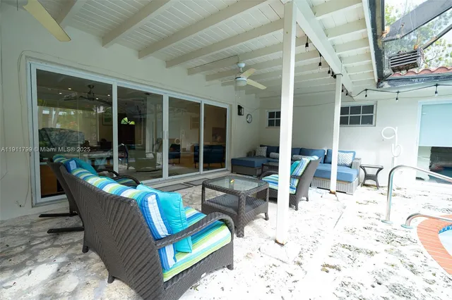 a outdoor living space with furniture and large window