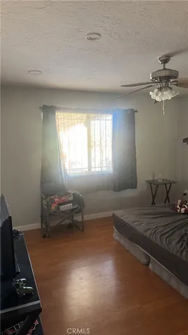 a view of a hallway with wooden shelves