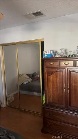 a bathroom with a sink a toilet and shower curtain