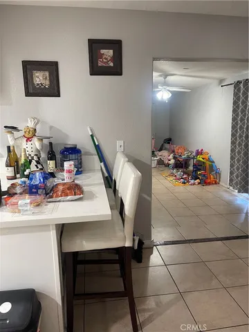 a kitchen with white cabinets and appliances