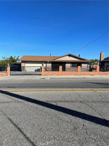 a view of a house with a fence