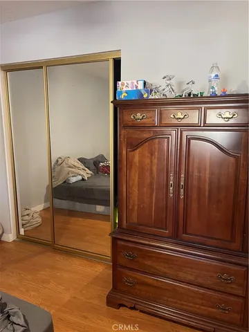 a bathroom with a sink mirror vanity and toilet