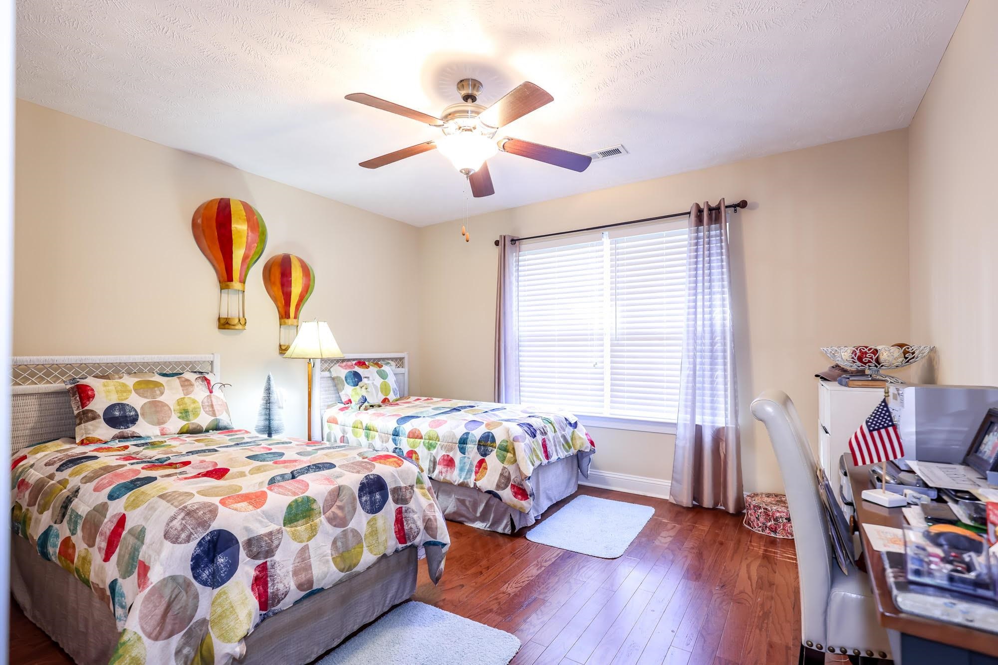 147 Quail Hollow Road Myrtle Beach, SC 29579 - Photo 16 of 35 Bedroom featuring hardwood / wood-style floors, ceiling fan, and a textured ceiling