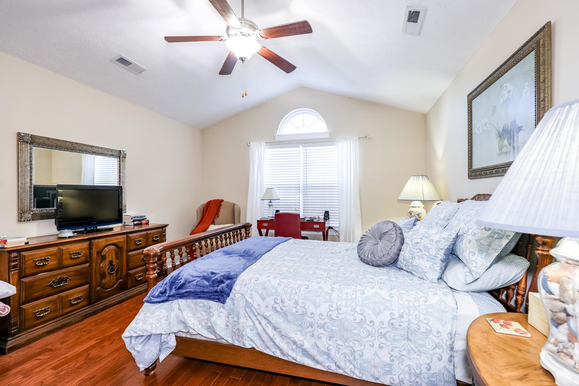 147 Quail Hollow Road Myrtle Beach, SC 29579 - Photo 17 of 35 Bedroom featuring vaulted ceiling, wood finished floors, and a ceiling fan