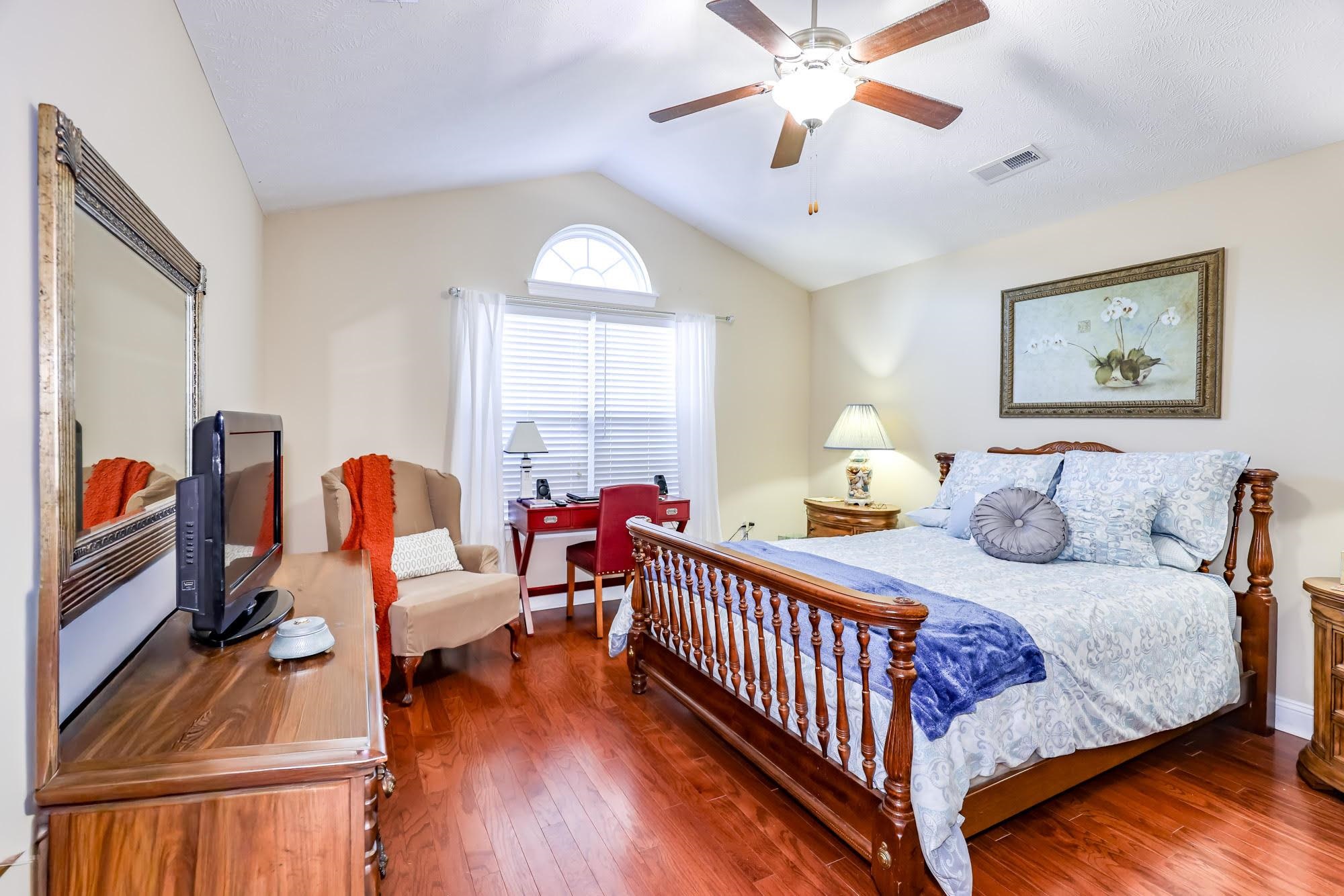 147 Quail Hollow Road Myrtle Beach, SC 29579 - Photo 20 of 35 Bedroom featuring vaulted ceiling, a ceiling fan, and wood-type flooring