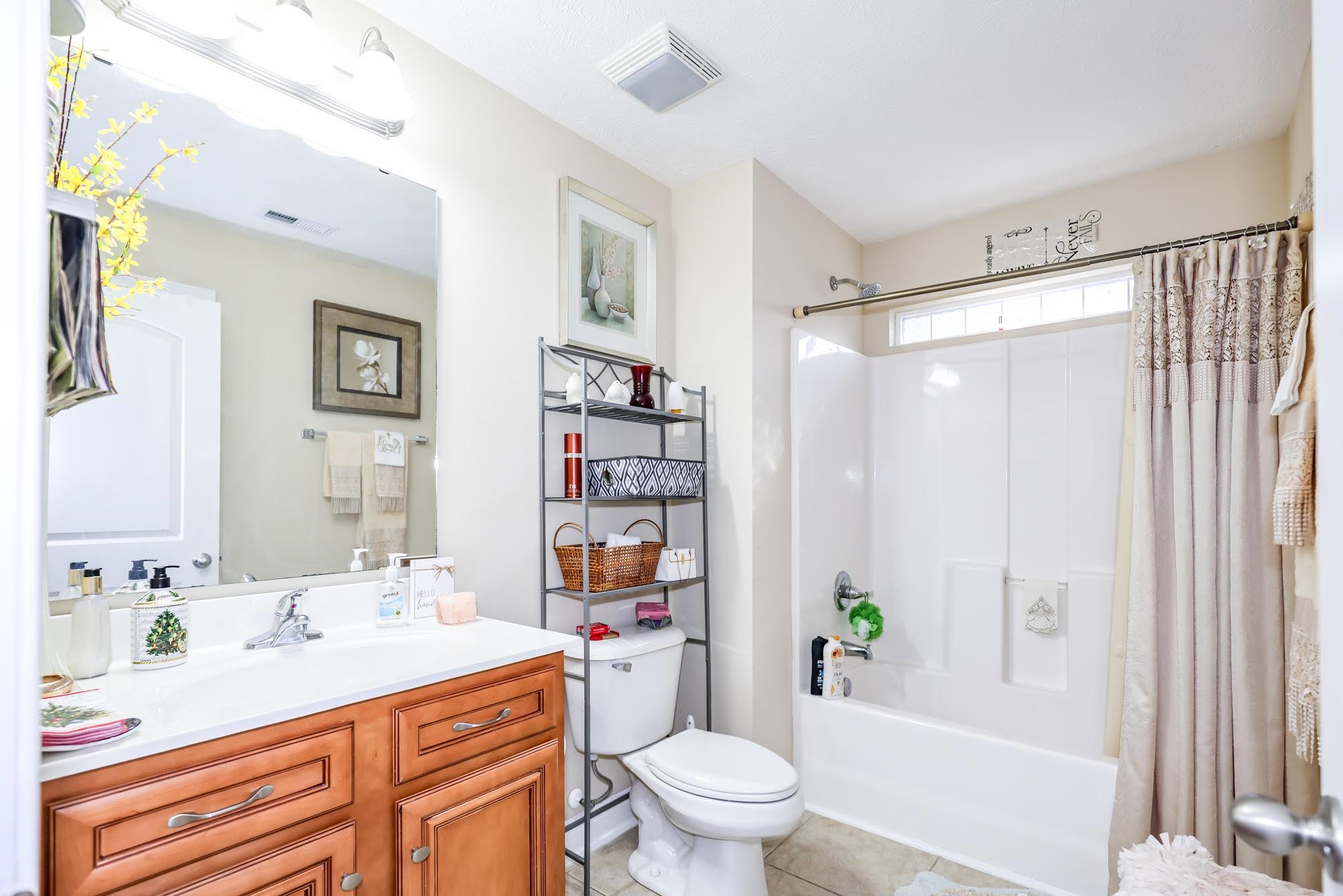 147 Quail Hollow Road Myrtle Beach, SC 29579 - Photo 21 of 35 Bathroom featuring shower / bath combo, vanity, and light tile patterned floors