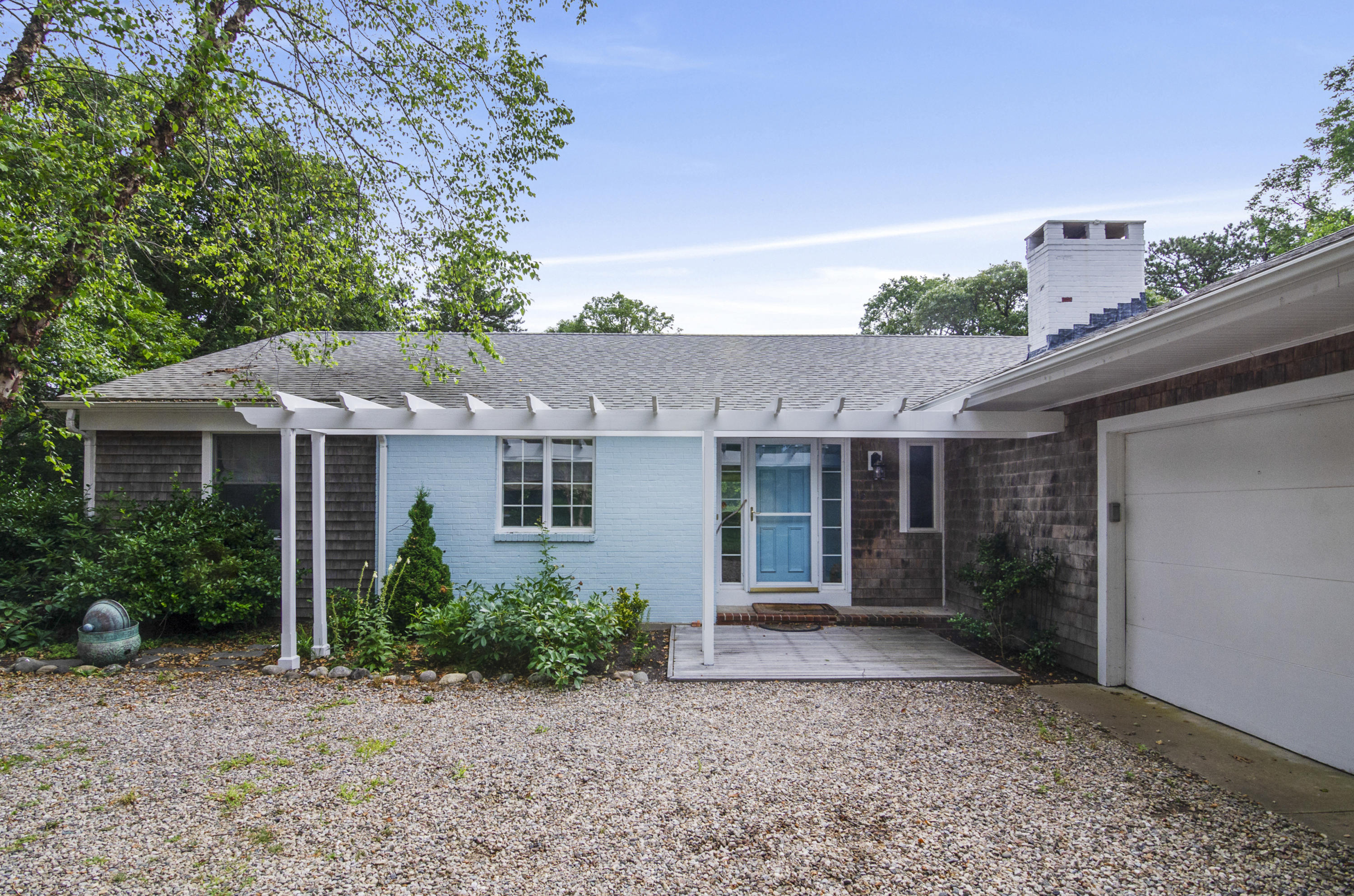 42 Round Cove Road Chatham, MA 02633 - Photo 1 of 26 a front view of a house with garden