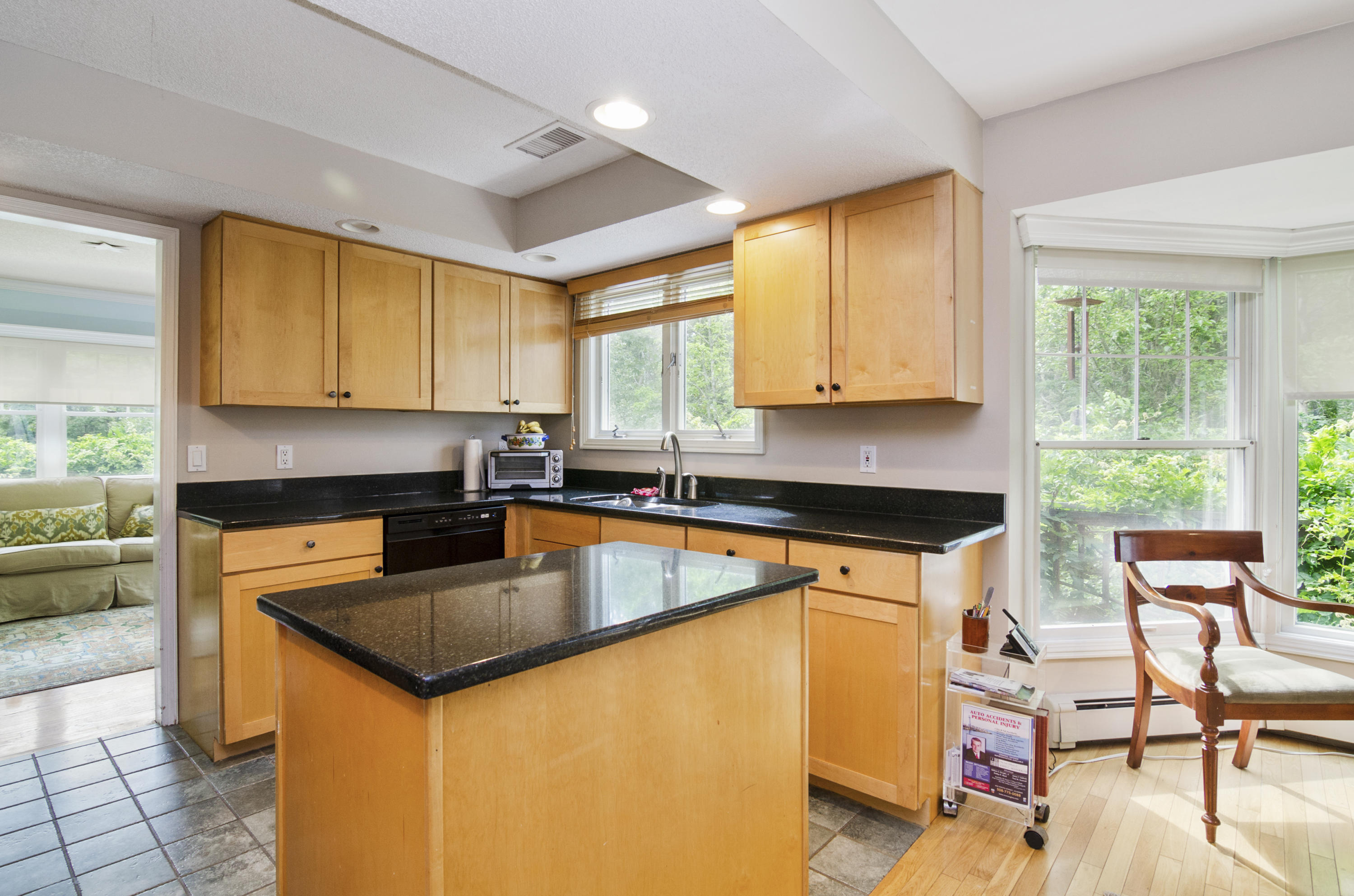 42 Round Cove Road Chatham, MA 02633 - Photo 11 of 26 a kitchen with stainless steel appliances granite countertop sink stove top oven and cabinets