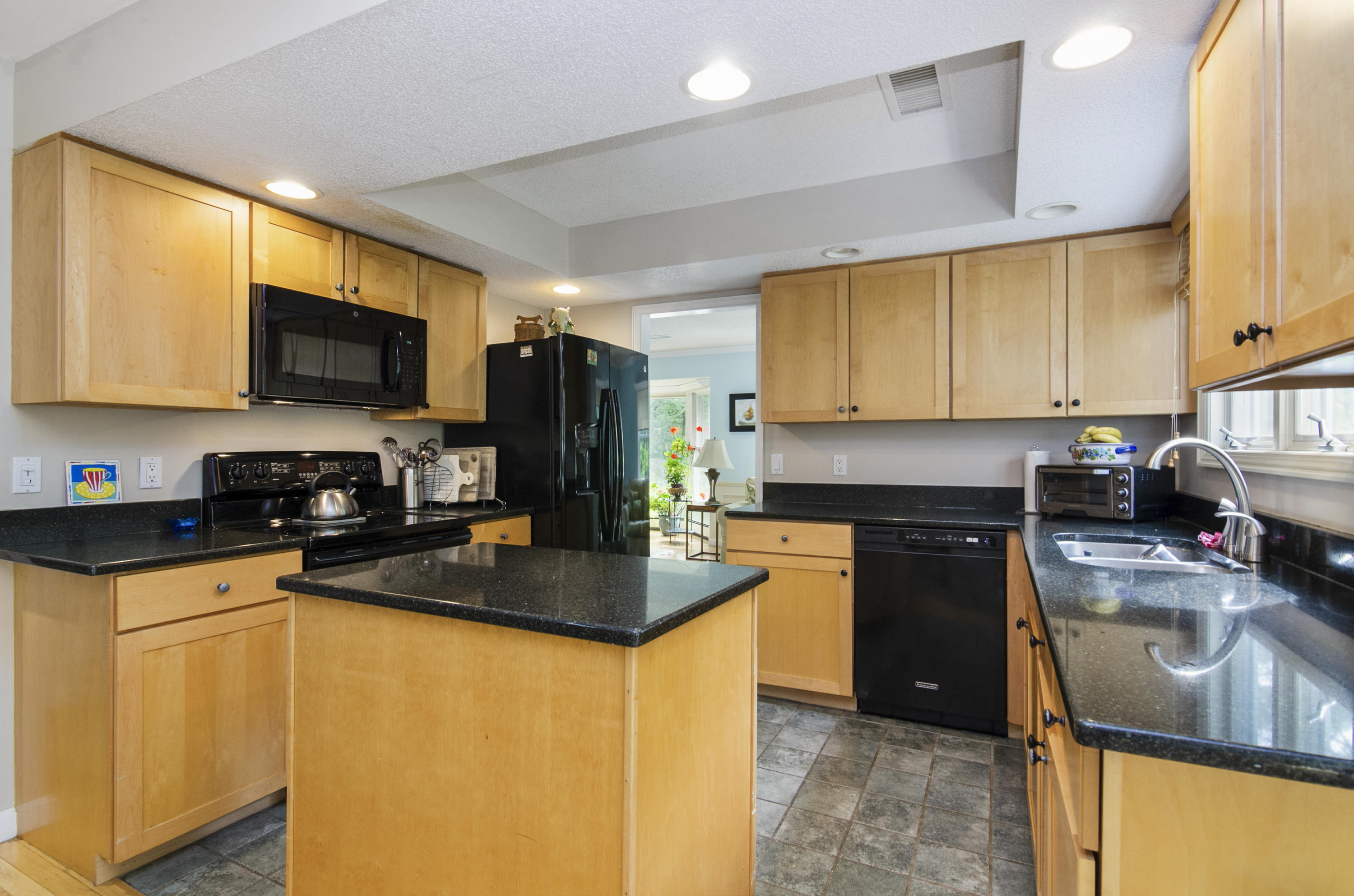 42 Round Cove Road Chatham, MA 02633 - Photo 12 of 26 a kitchen with granite countertop a sink a counter top space appliances and cabinets