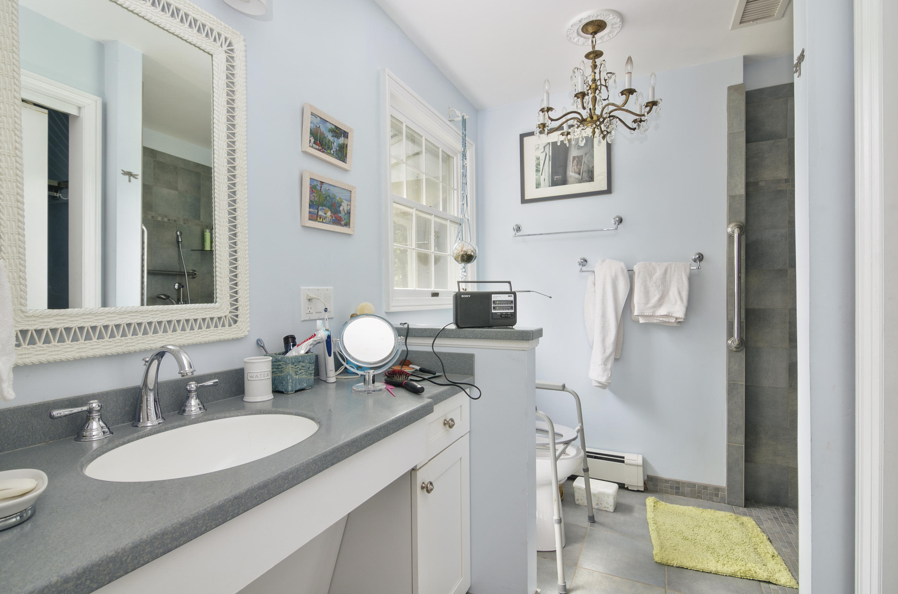 42 Round Cove Road Chatham, MA 02633 - Photo 14 of 26 a bathroom with a granite countertop sink mirror and vanity