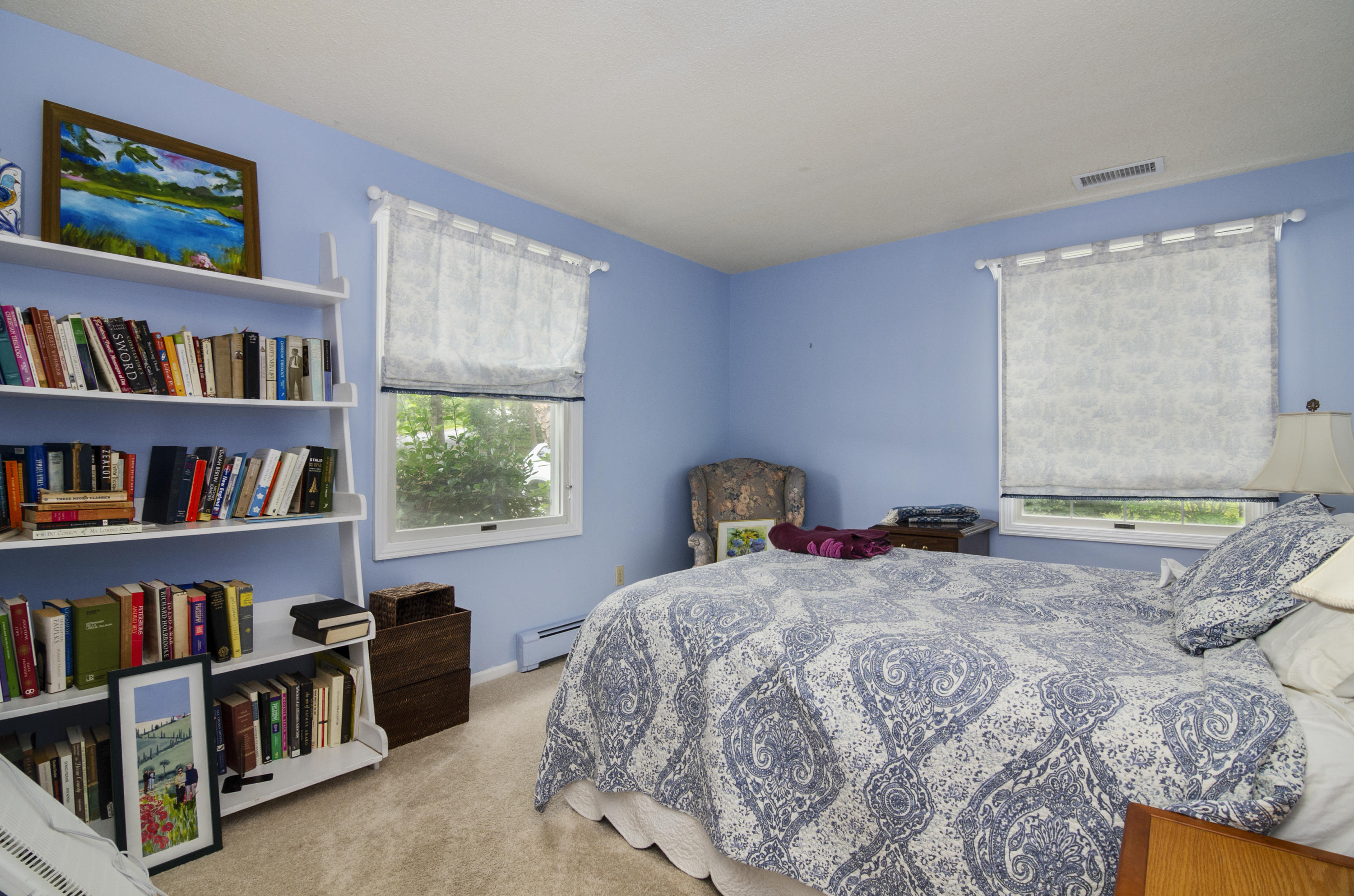 42 Round Cove Road Chatham, MA 02633 - Photo 16 of 26 a bedroom with a bed a dresser and a book shelf