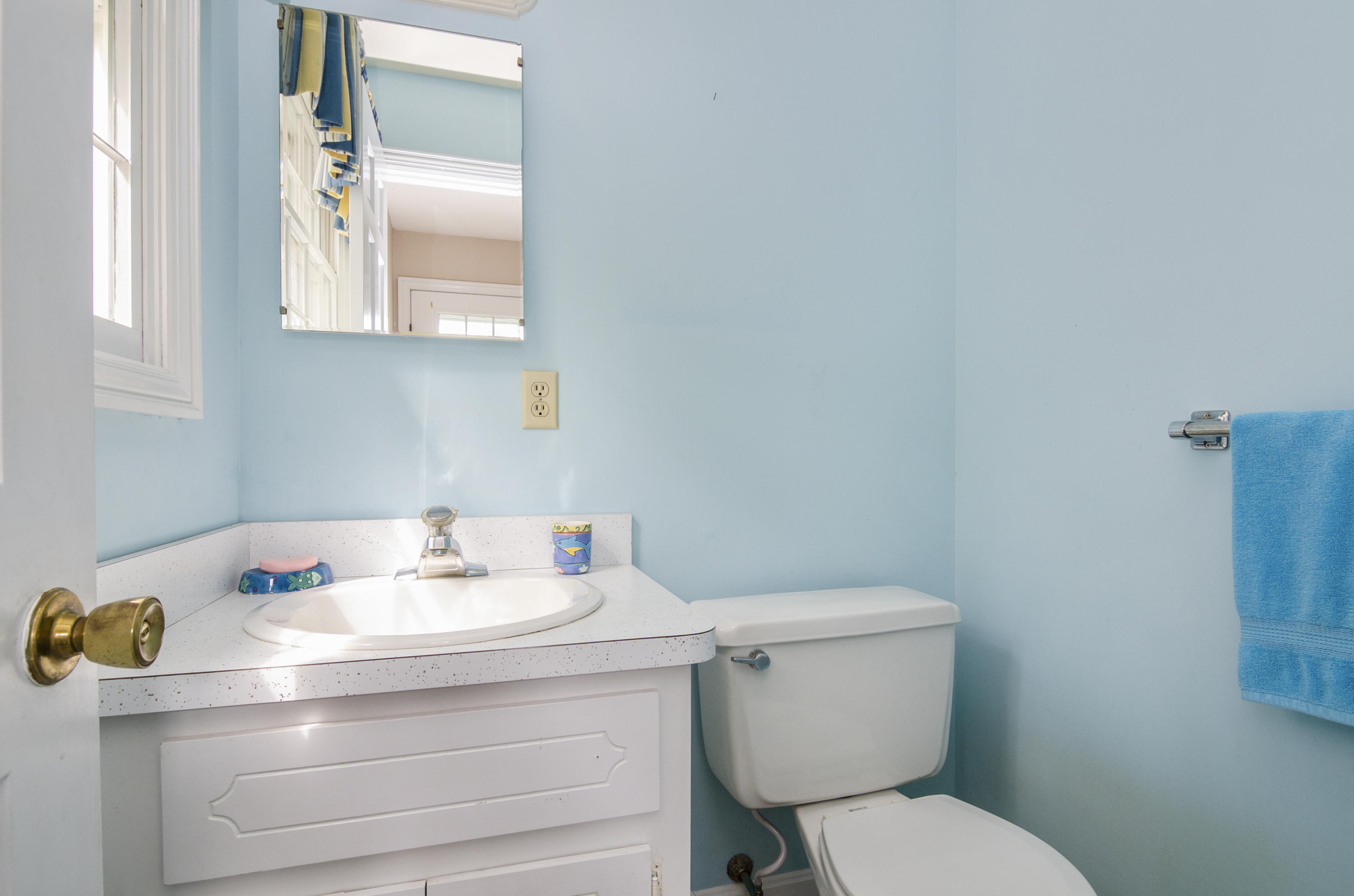 42 Round Cove Road Chatham, MA 02633 - Photo 20 of 26 a bathroom with a sink mirror and toilet