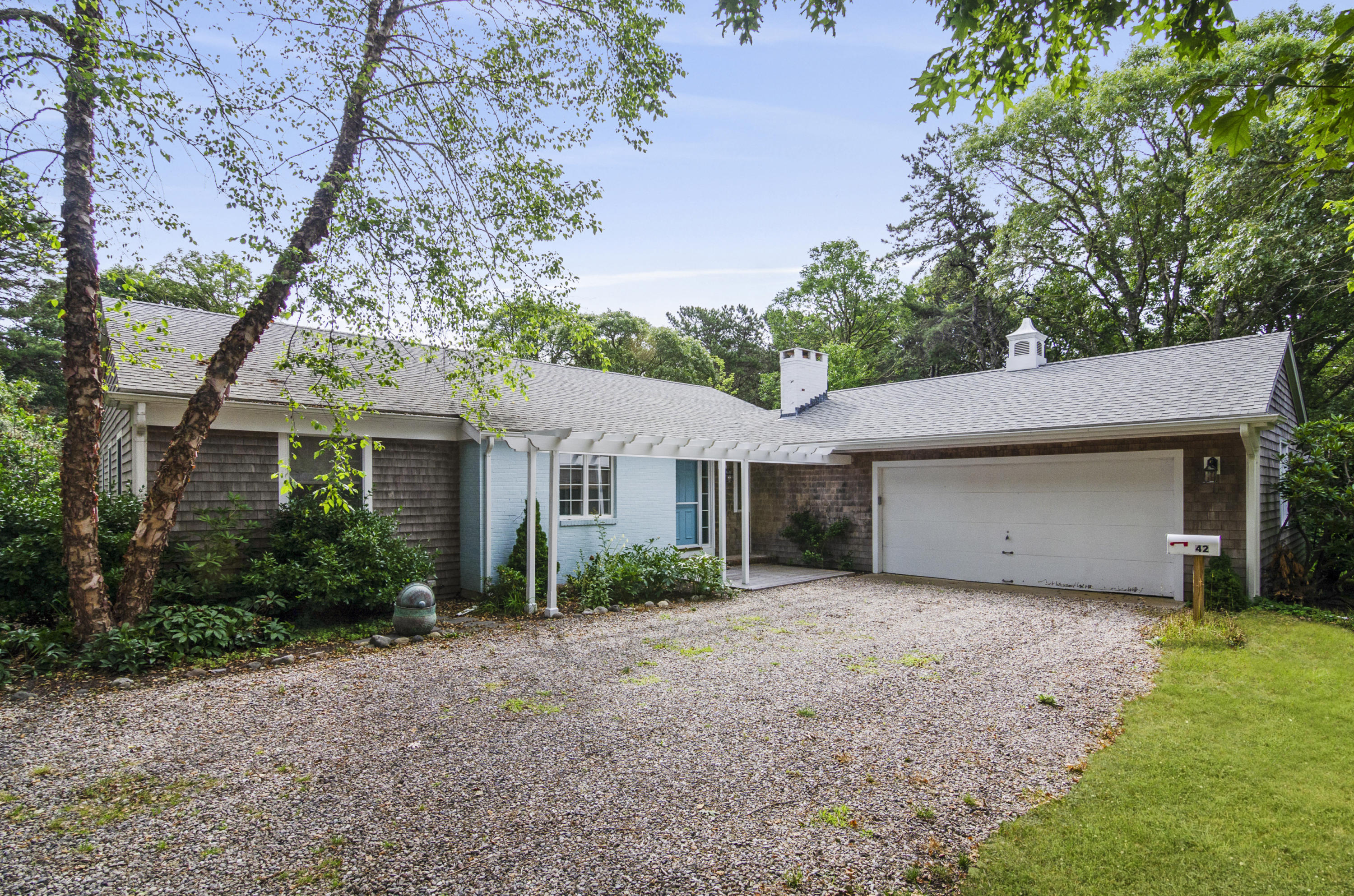 42 Round Cove Road Chatham, MA 02633 - Photo 2 of 26 a front view of house with yard and trees