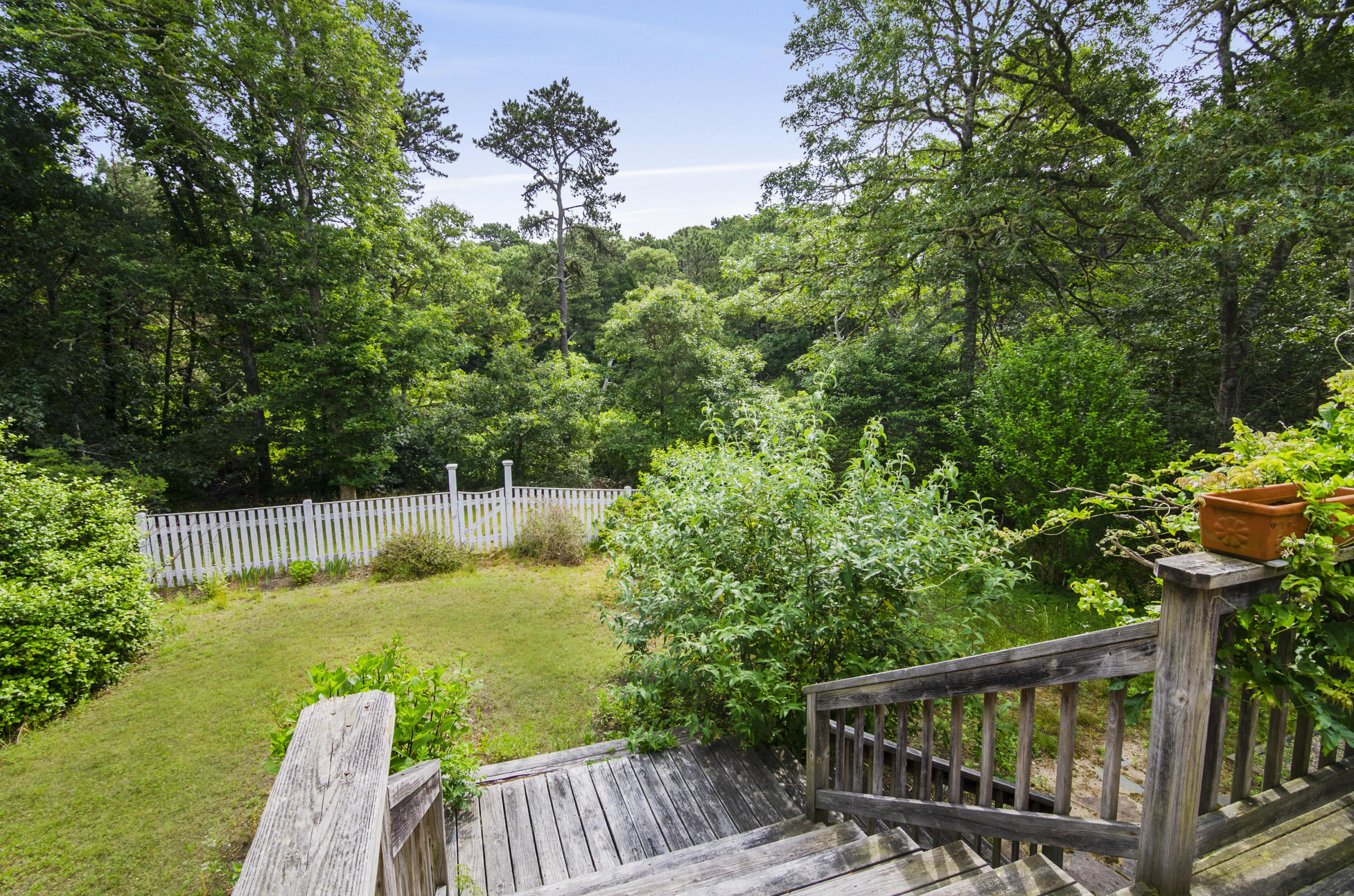 42 Round Cove Road Chatham, MA 02633 - Photo 25 of 26 a view of a chair and table in the garden