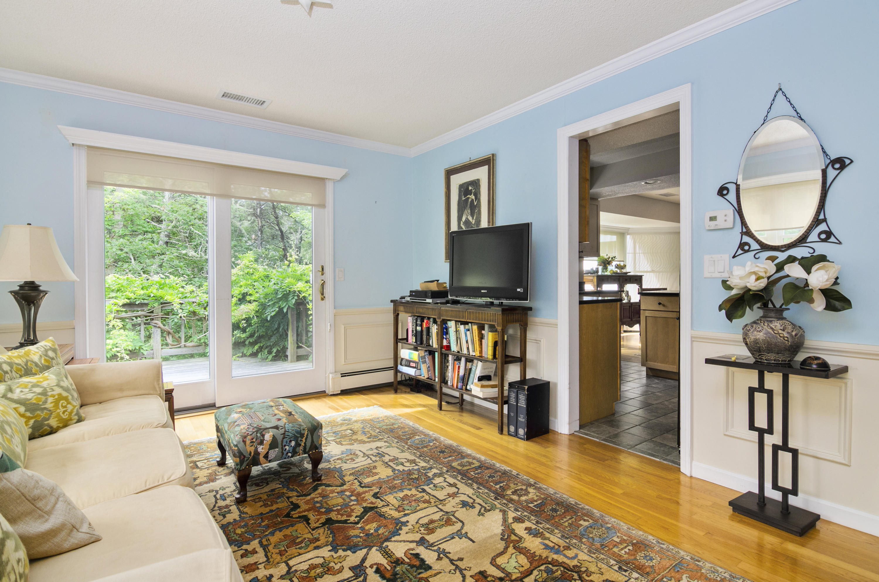42 Round Cove Road Chatham, MA 02633 - Photo 8 of 26 a living room with furniture a piano and a floor to ceiling window