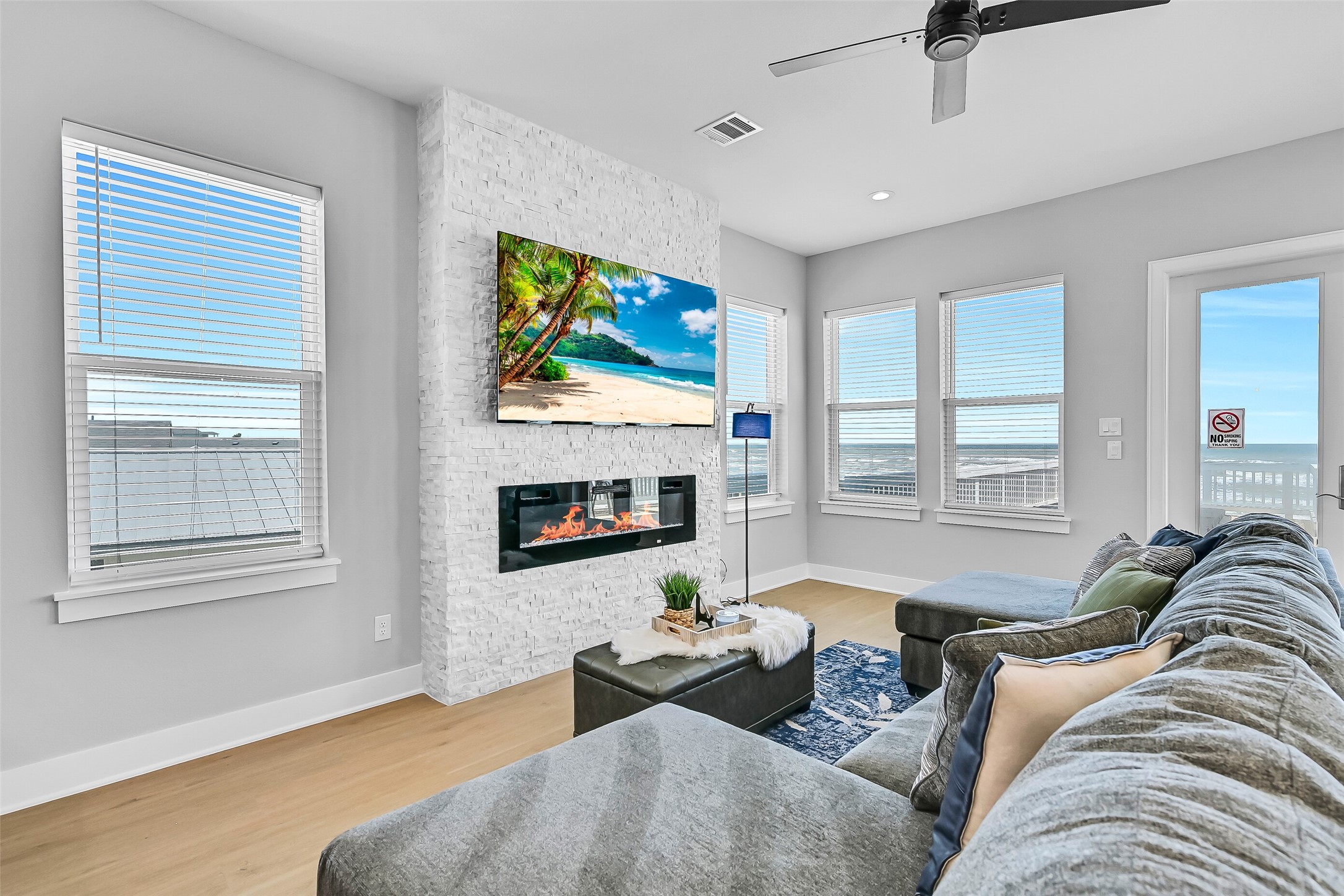 16728 West Beach Road Jamaica Beach, TX 77554 - Photo 10 of 46 Designed for both comfort and entertaining, the living room provides ample space for family and guests.
