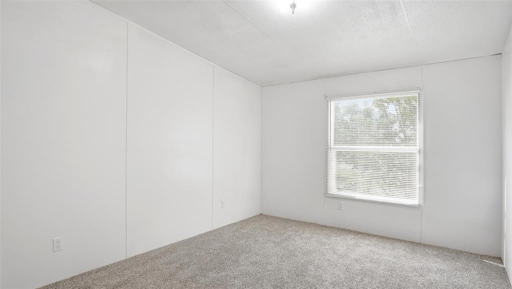 10902 County Road 414 Merkel, TX 79536 - Photo 21 of 26 an empty room with a window