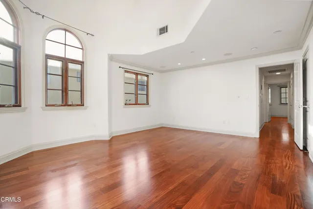 a bathroom with a granite countertop sink a mirror and a shower