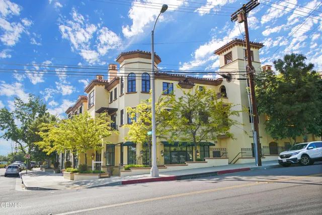 a view of a house with a flower garden