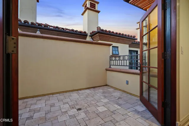 front view of a building with a garden