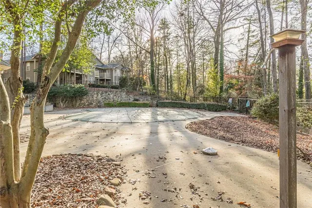 a view of a house with a tree in the background