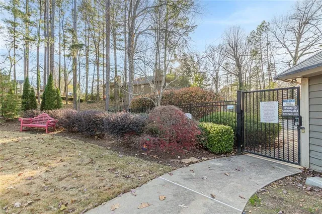 a view of a patio with couches chairs and a fire pit