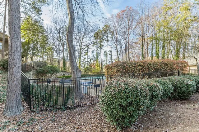 a white bench sitting in front of a building