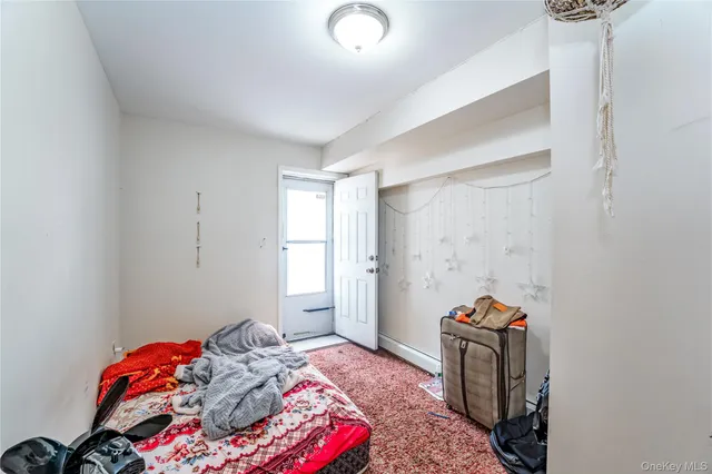 a view of a dining room with furniture and a window