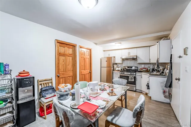 a view of a hallway with wooden floor and windows