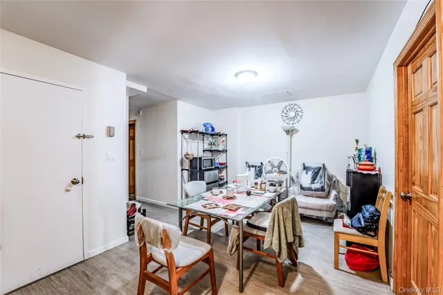a view of a hallway with closet and workspace