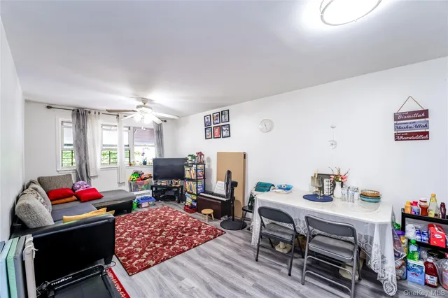 a living room with furniture a rug and a chandelier