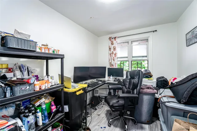 a bedroom with furniture and a window