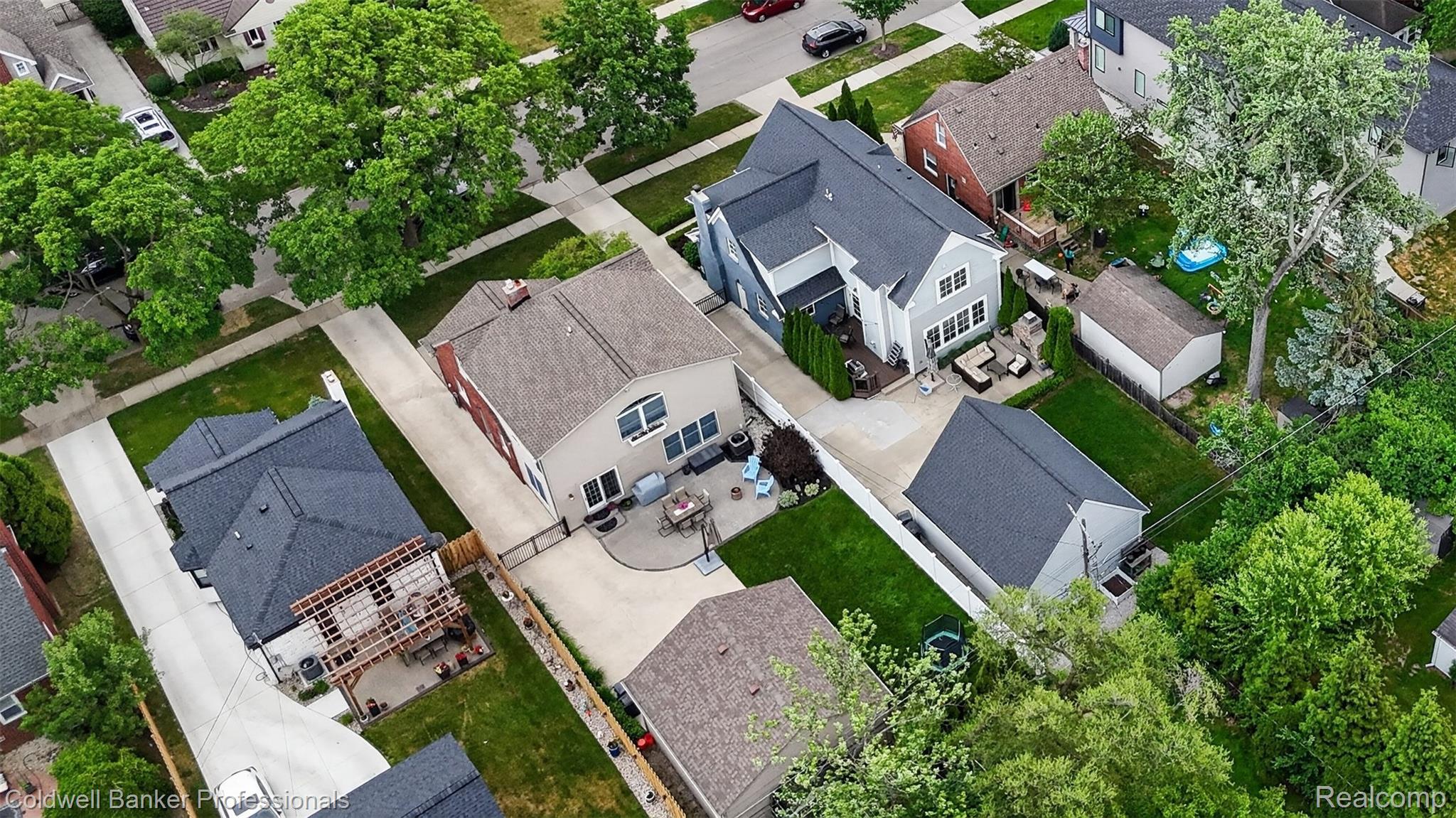 2666 Windemere Road Birmingham, MI 48009 - Photo 21 of 24 Aerial perspective showcasing a light grey two-story residence with a dark grey roof