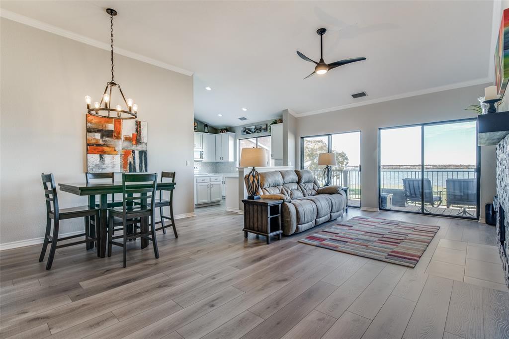 1912 Signal Ridge Place Rockwall, TX 75032 - Photo 1 of 1 a view of a dining room and livingroom with furniture wooden floor a chandelier