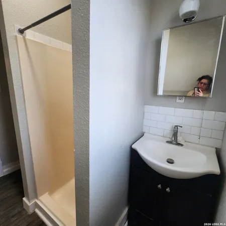 a bathroom with a sink and a mirror