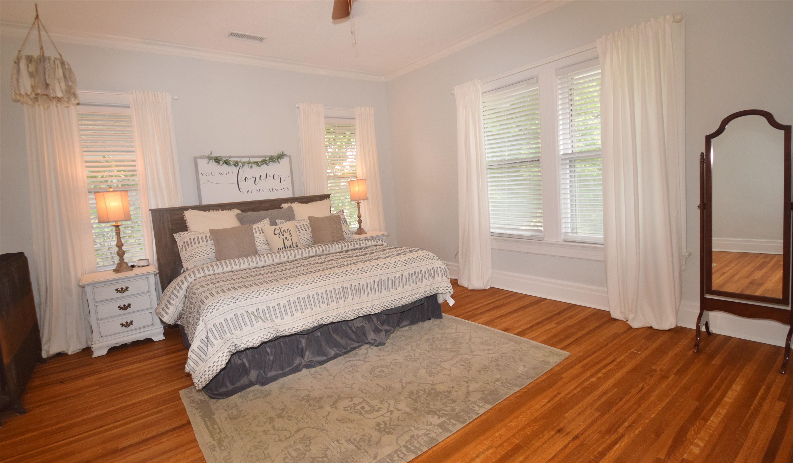 263 Stonewall Street Memphis, TN 38112 - Photo 15 of 25 a bedroom with a bed and wooden floor