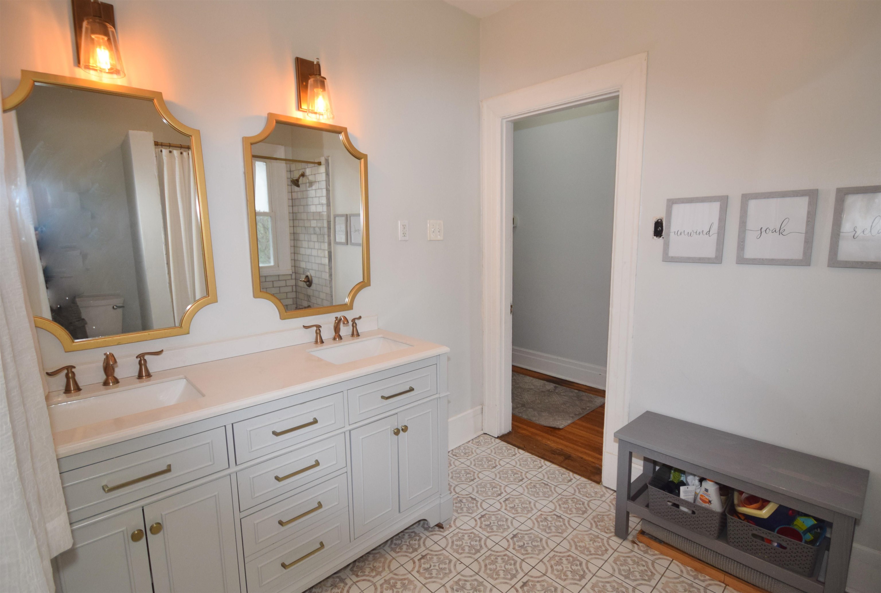 263 Stonewall Street Memphis, TN 38112 - Photo 20 of 25 a bathroom with a double vanity sink and mirror