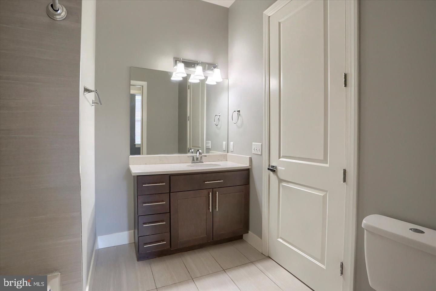 231 State Street, Unit 204 Harrisburg, PA 17101 - Photo 14 of 16 a bathroom with a double vanity sink and a mirror