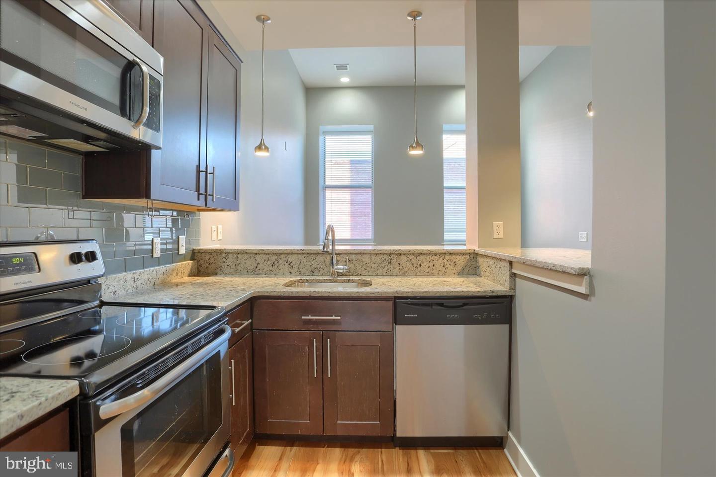231 State Street, Unit 204 Harrisburg, PA 17101 - Photo 10 of 16 a kitchen with a sink stove and cabinets