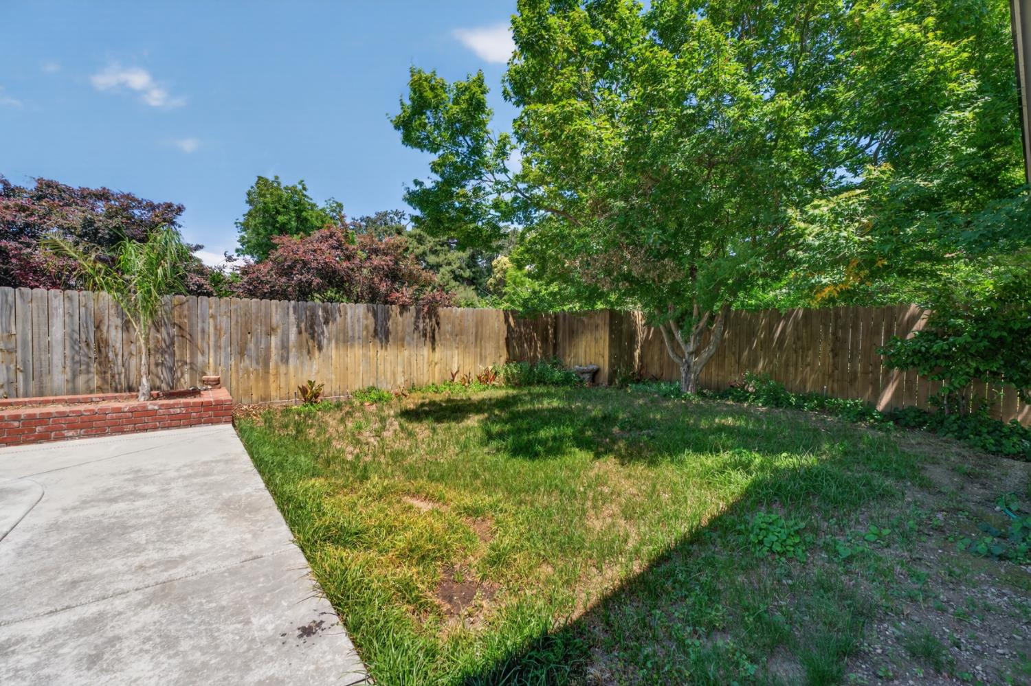 1880 Magnolia Street Gridley, CA 95948 - Photo 62 of 95 a view of a backyard with plants and a lake view