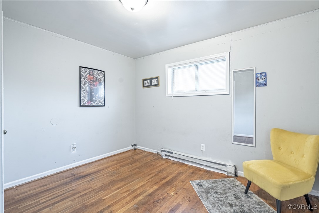 5316 Germain Road Richmond, VA 23224 - Photo 16 of 20 Bedroom with dark wood-type flooring and a baseboa