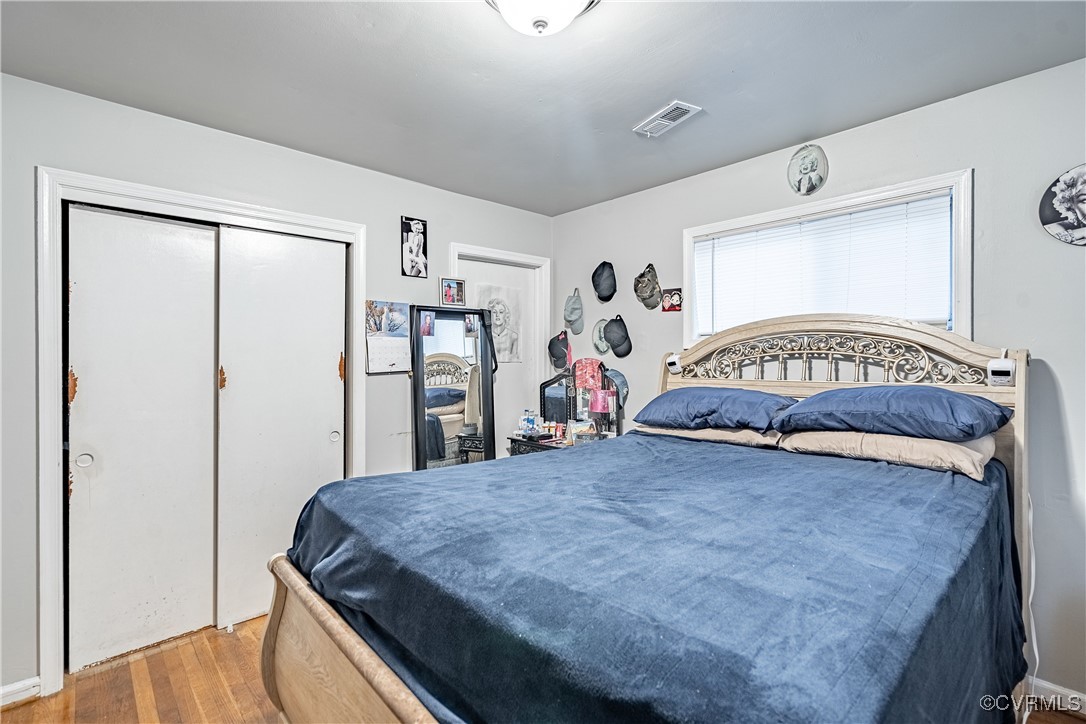 5316 Germain Road Richmond, VA 23224 - Photo 10 of 20 Bedroom with a closet and hardwood / wood-style fl