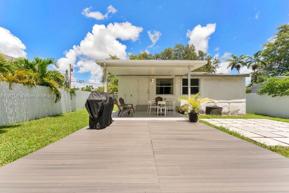 180 Northwest 69th Street Miami, FL 33150 - Photo 22 of 31 a view of a house with a patio