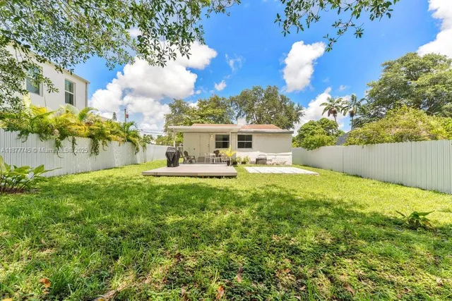 a view of house with outdoor space and swimming pool
