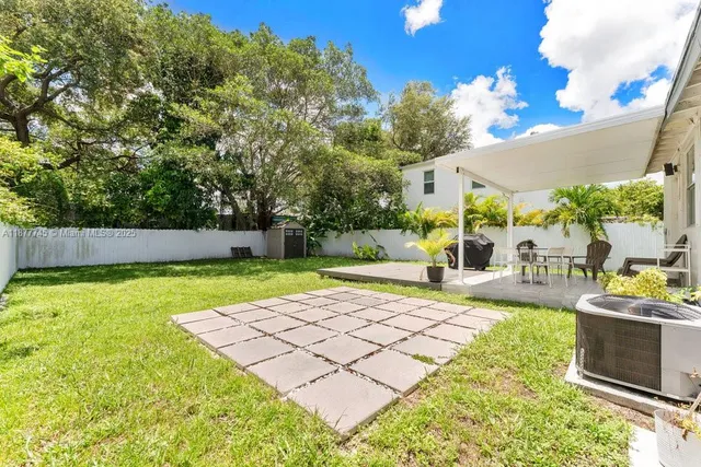 a view of a backyard with a garden and plants