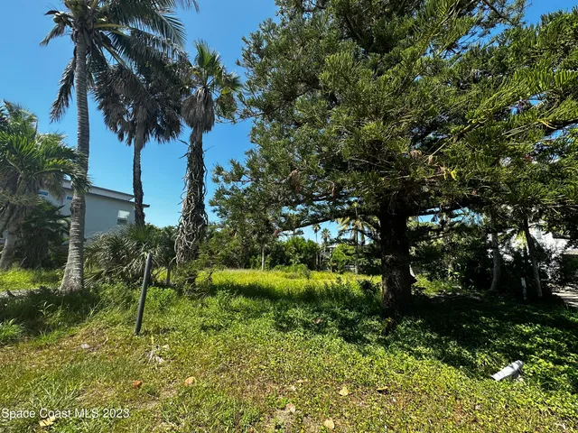 a view of a backyard of the house