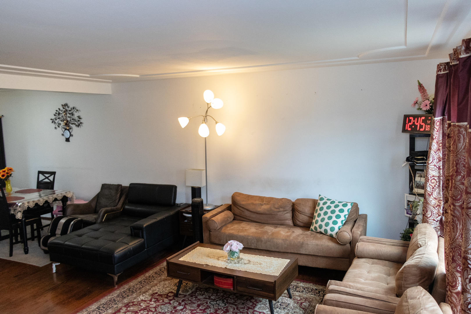 1488 Willow Avenue Des Plaines, IL 60016 - Photo 4 of 25 a living room with furniture a lamp and a potted plant
