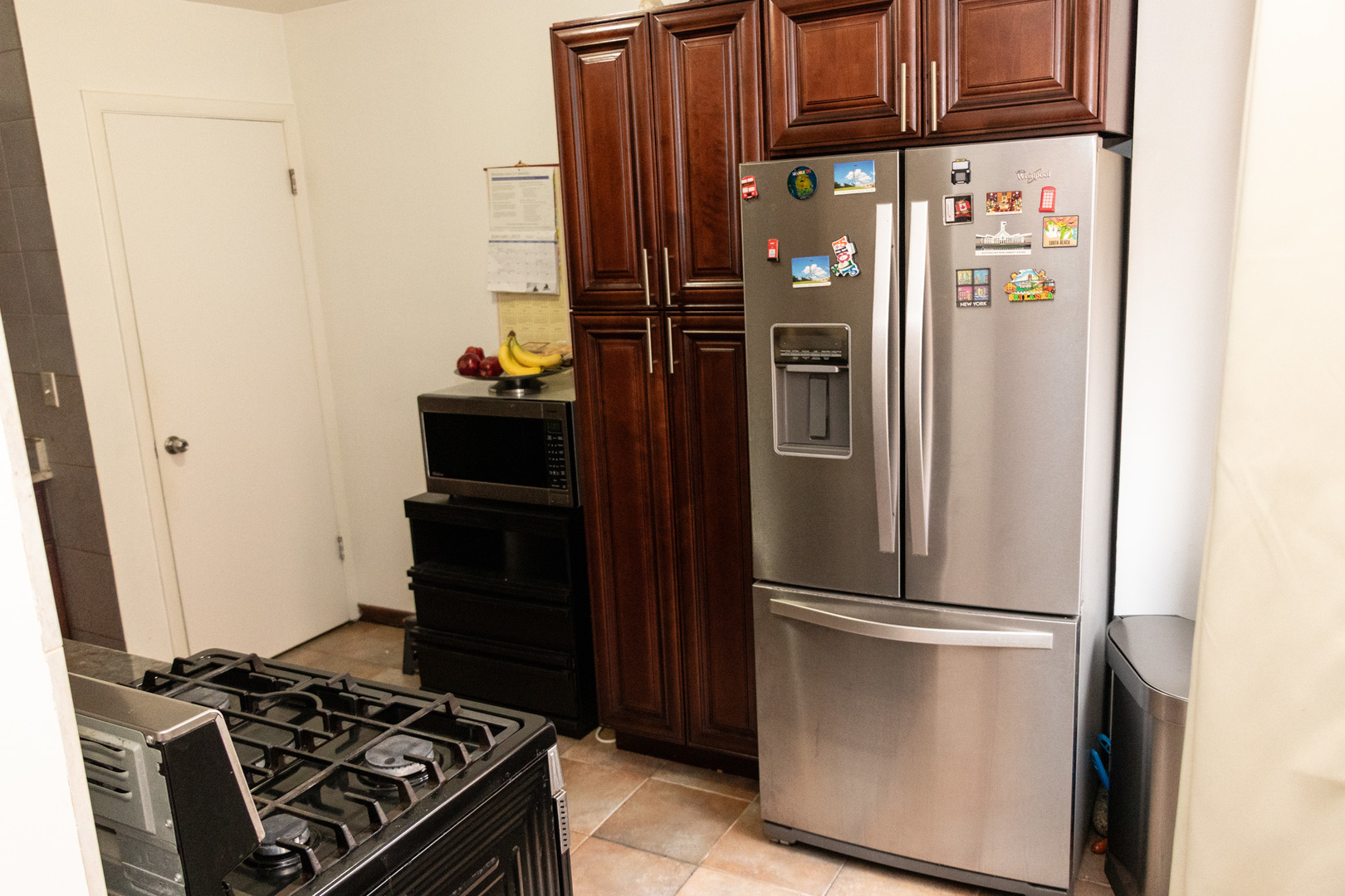 1488 Willow Avenue Des Plaines, IL 60016 - Photo 7 of 25 a kitchen with a refrigerator and a stove top oven