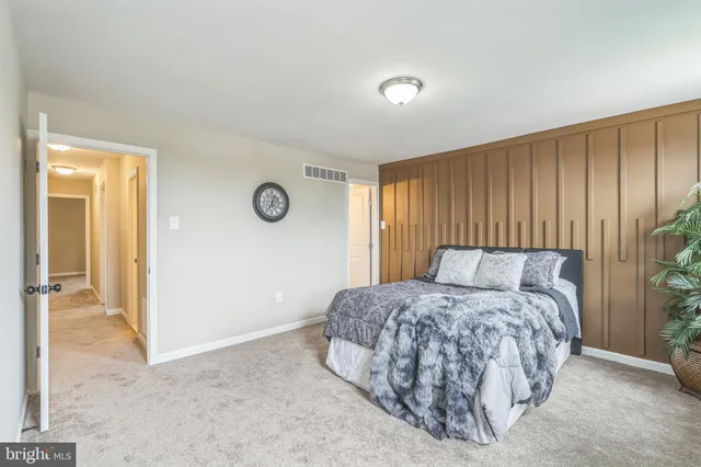 a bedroom with a bed and a cabinets