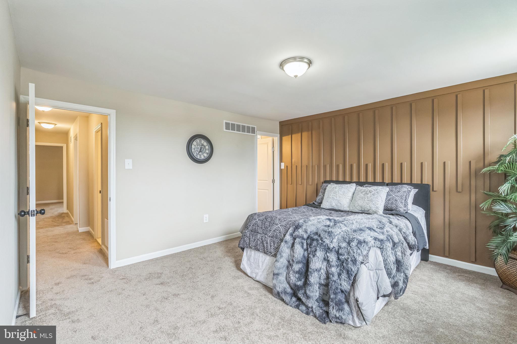 5734 Harbison Avenue Philadelphia, PA 19135 - Photo 12 of 29 a bedroom with a bed and a cabinets